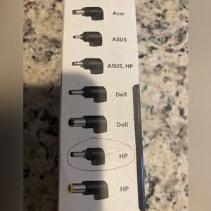 Box with different laptop charger tips